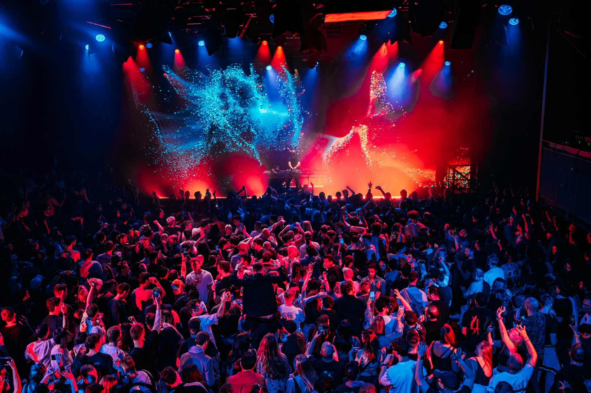 Live music and nightlife event at The Prospect Building, with a large crowd and colourful stage lighting